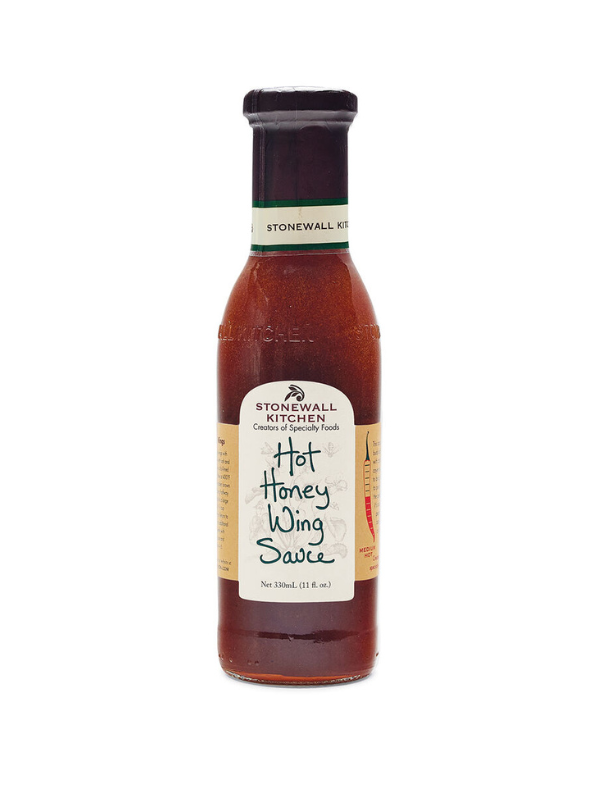 A bottle of Hot Honey Wing Sauce by Stonewall Kitchen with a label showing the product name and the phrase 'The South's Best Hot Sauce'.