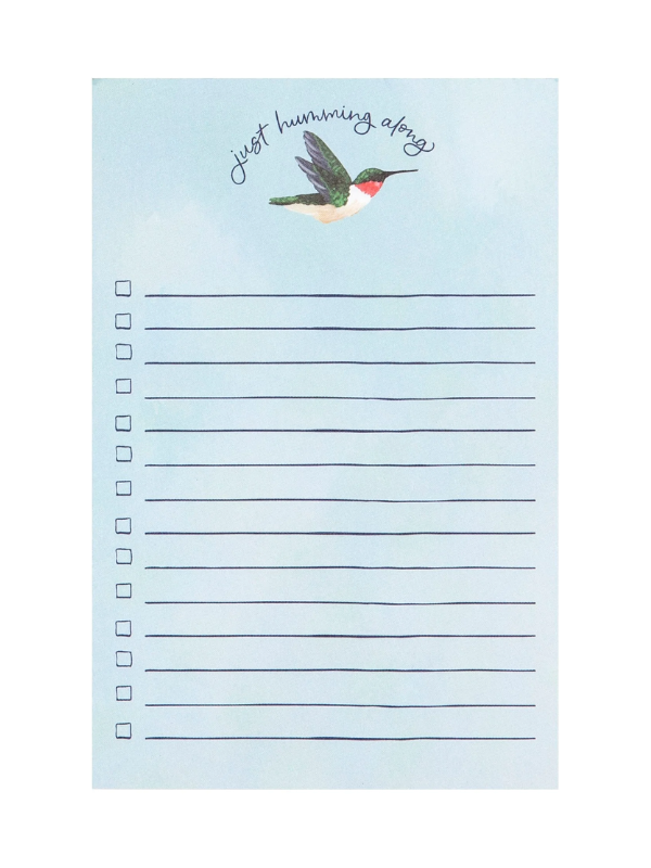 Notepad with a hummingbird illustration and text on a light blue background