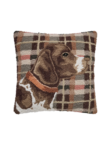 Decorative pillow with a plaid pattern and a dog illustration
