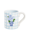 Mug with floral design and checkered pattern on a white background