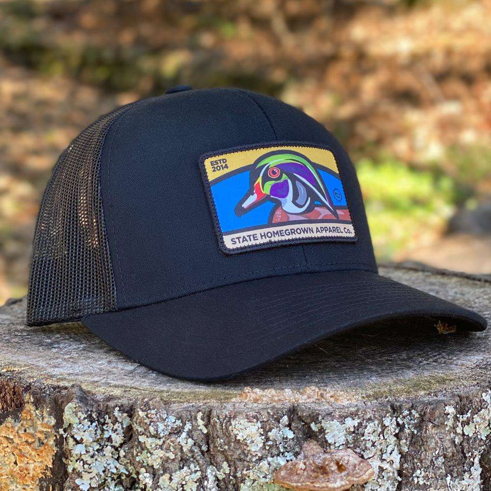 Wood Duck Trucker Hat in Black by State Homegrown