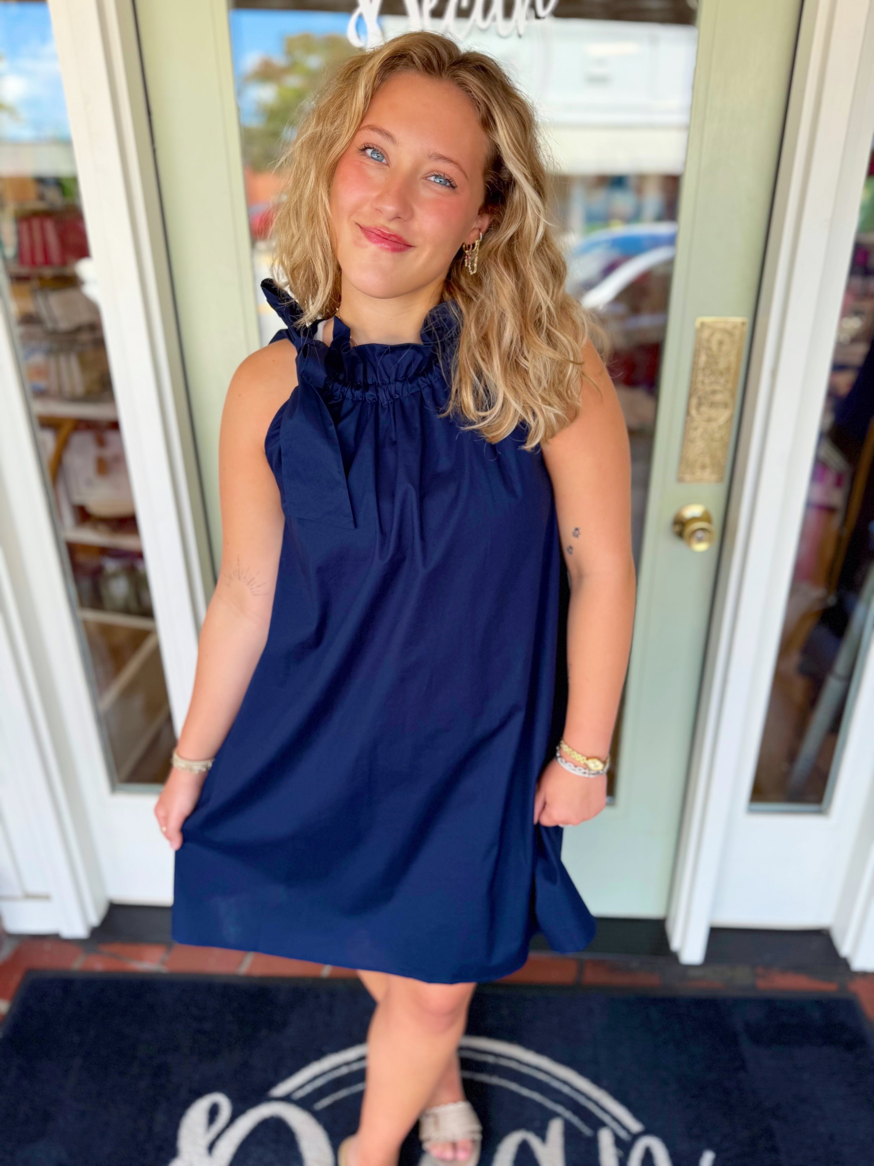 The Gracie Ruffle Tie Neck Dress in Navy