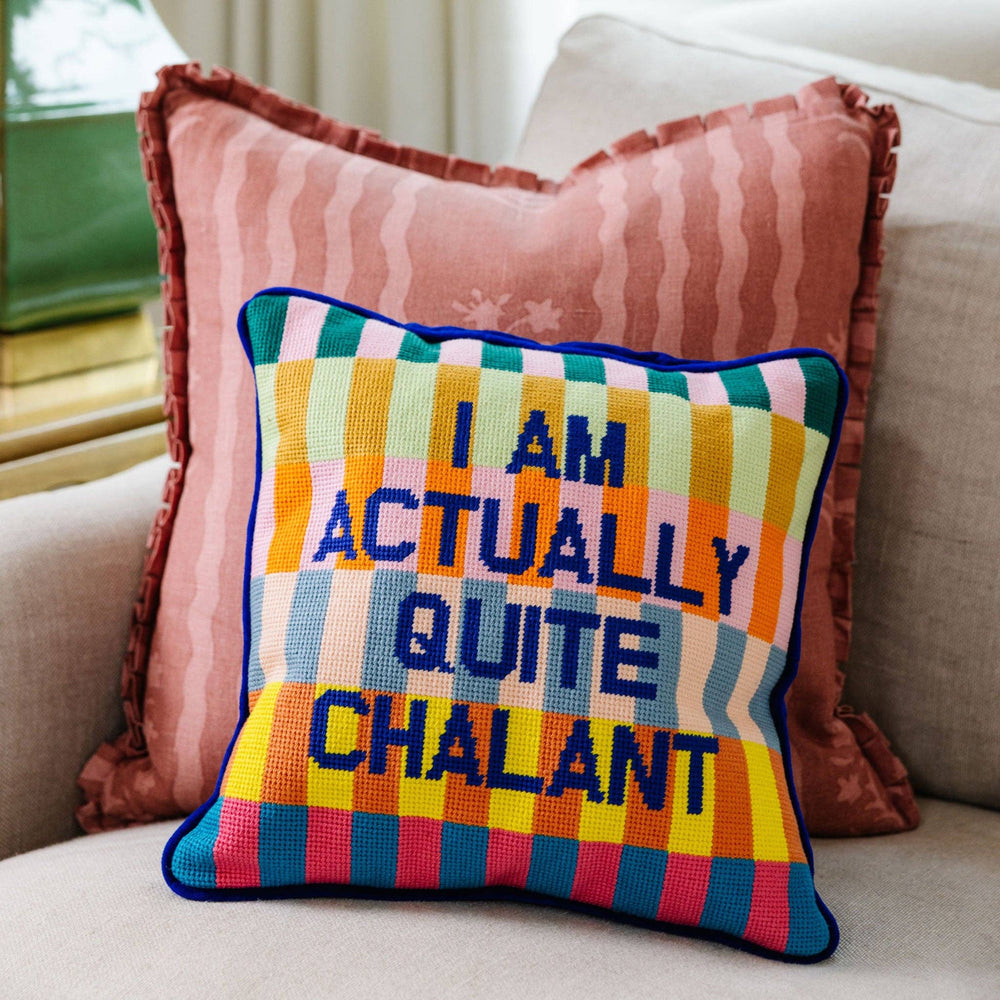 Colorful pillow with text on a couch