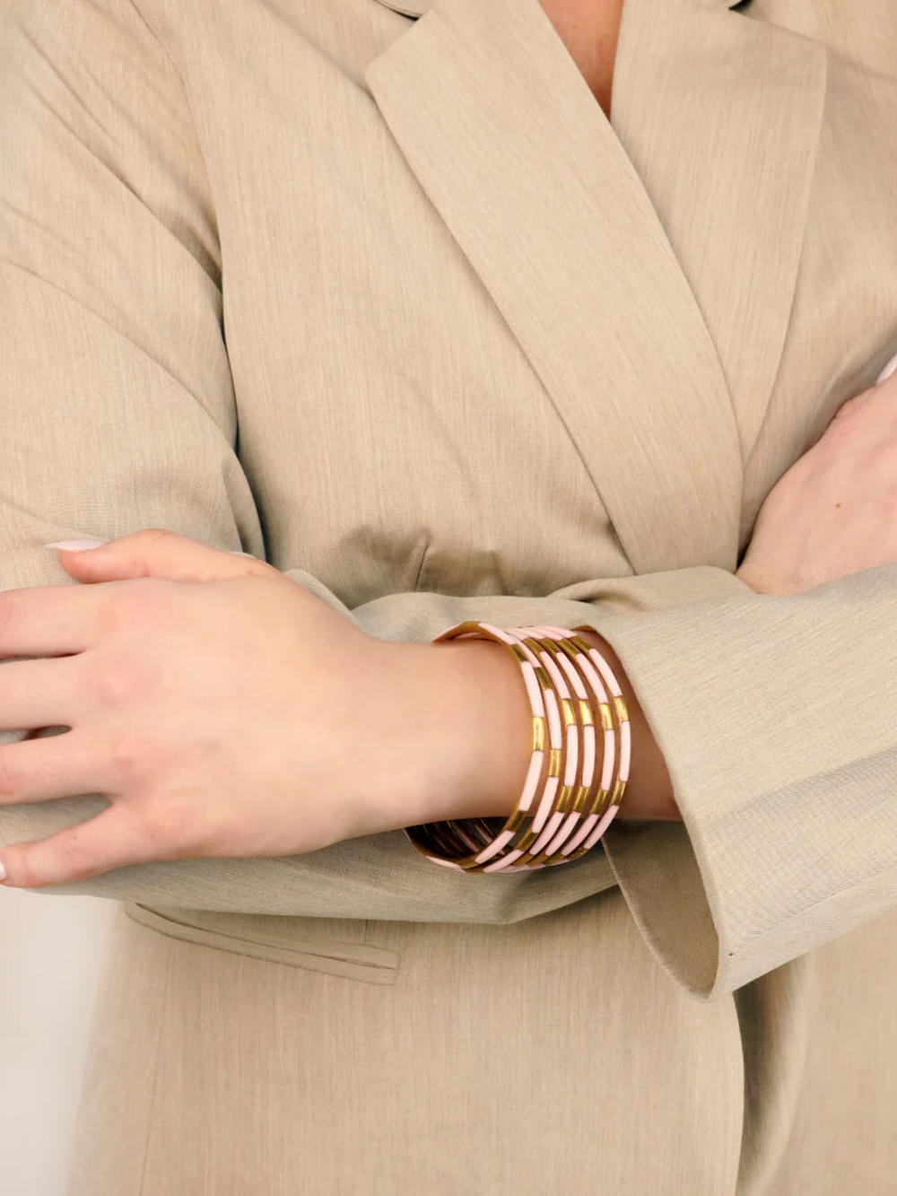 Ice Rose Veda Bangles set of six in soft blush on someones arm