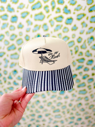 Black striped bill embroidered hat with "In No Rush" on it