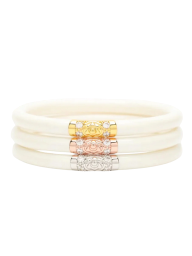 Set of cream-colored bracelets with gold, rose gold, and silver accents