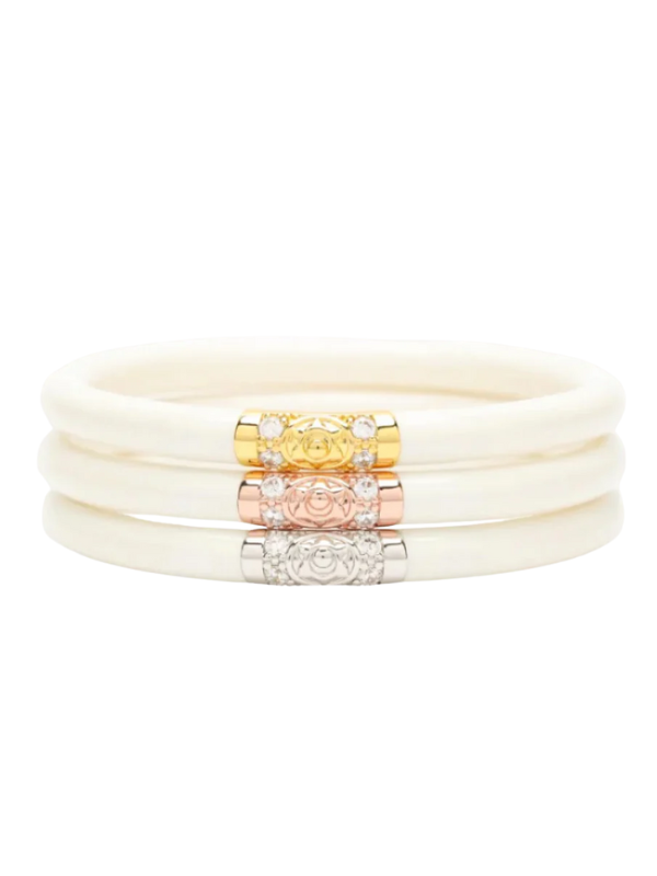 Set of cream-colored bracelets with gold, rose gold, and silver accents
