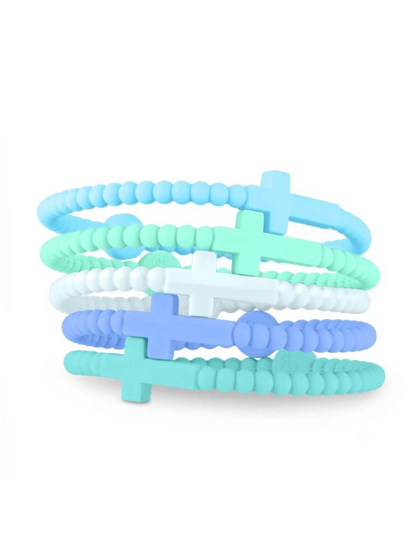 Five silicone beaded bracelets stacked together, featuring pastel blue, mint green, white, and periwinkle cross charms on a clean white background.