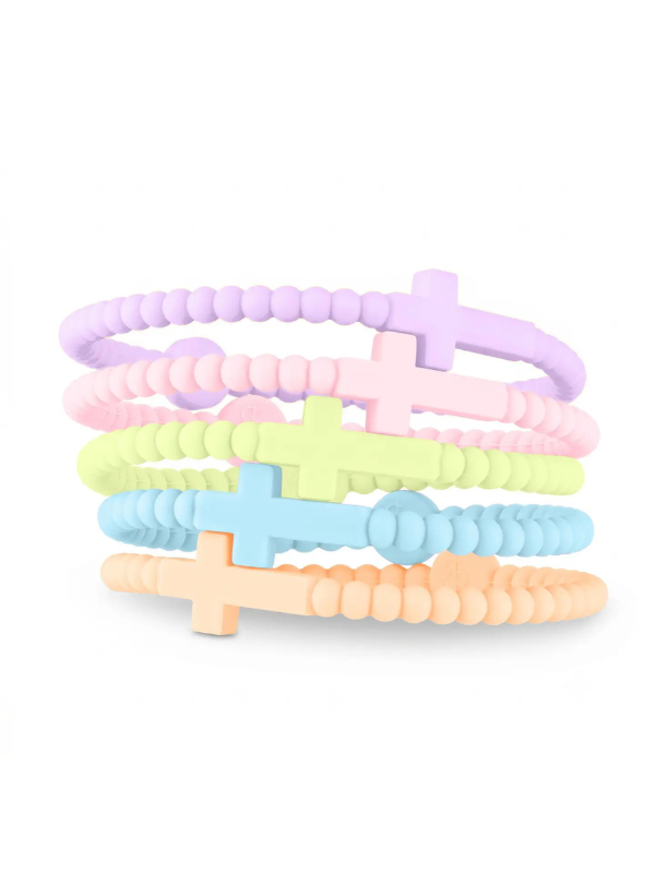 Five pastel beaded bracelets stacked together on a white background, featuring cross charms in lavender, pink, light green, light blue, and peach.