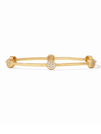 Gold bracelet with circular ends on a white background