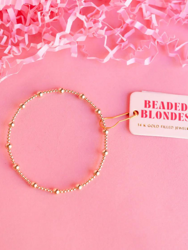 A gold-filled bracelet with mixed size beads