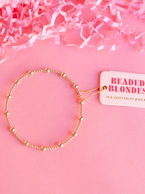 A gold-filled bracelet with mixed size beads