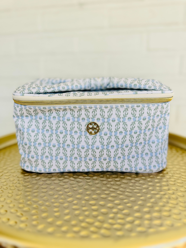 Blue floral makeup bag with zipper and bow handle