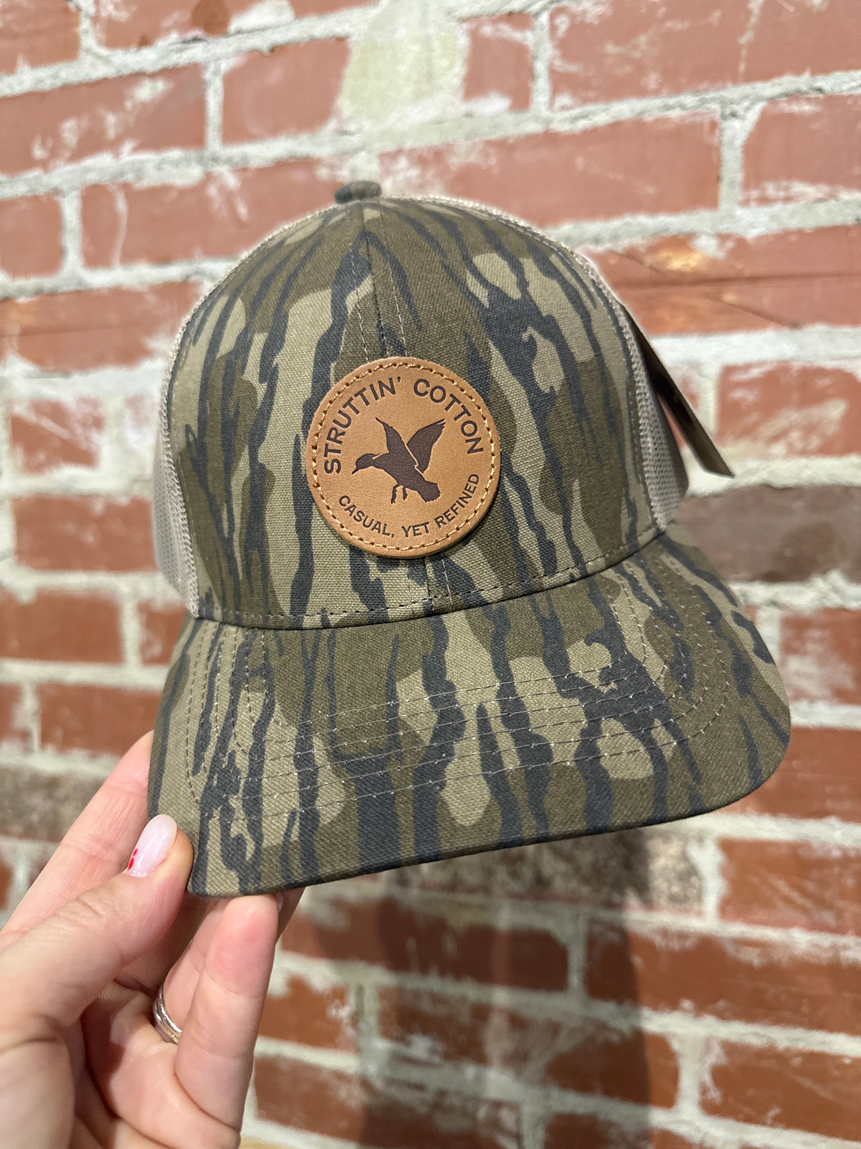 Leather Woodie Circle Patch Snap Back Trucker Hat in Bottomland Camo 