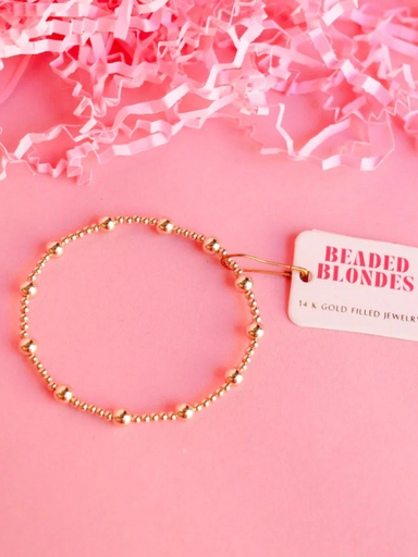 A gold filled beaded bracelet with bigger accent gold beads