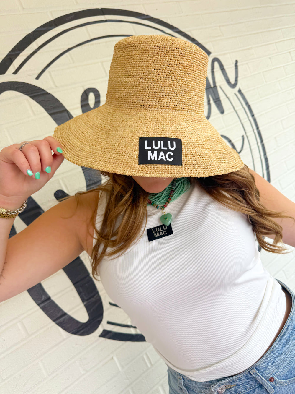 Raffia hat with brand embroidered tag 
