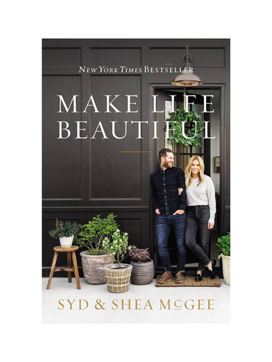 Book cover of 'Make Life Beautiful' by Syd & Shea McGee with a couple standing in a room.