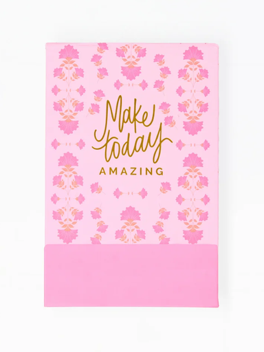 Pink notebook with floral pattern and 'Make today amazing' text on a white background