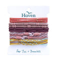 Set of hair ties and bracelets on a Haven branded card