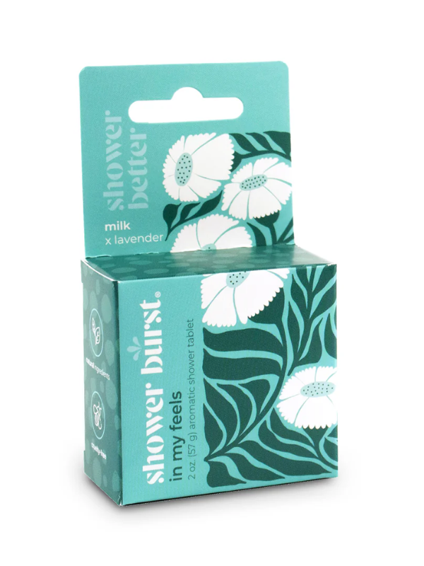 Teal packaging of Shower Burst product with floral design on a white background