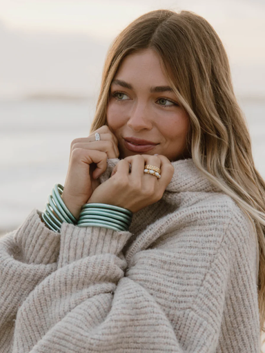 Mint all weather bangles on girl at the beach