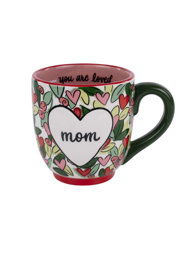 Colorful floral mug with heart design and 'mom' text on a white background.