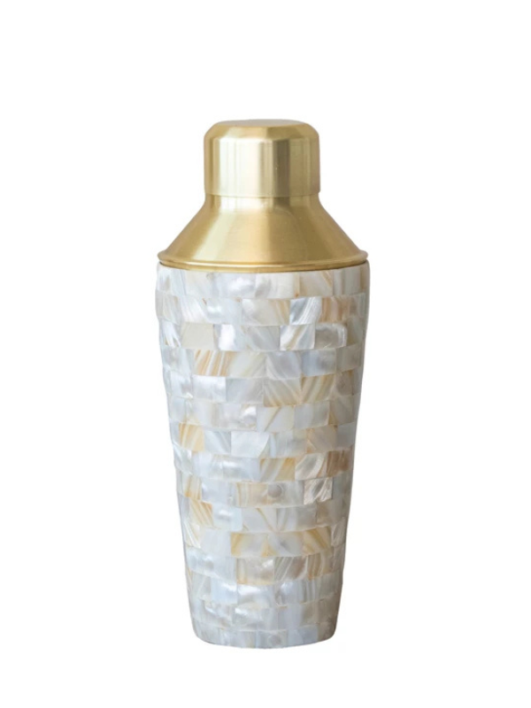 A stainless steel cocktail shaker with mother of pearl inlay and a gold finish cap.