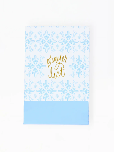 Notebook with blue floral pattern and gold text on a white background