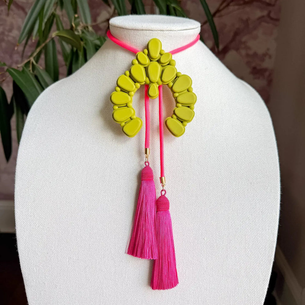 A bold reimagining of an iconic western silhouette, the Naja Bolo Necklace brings oversized charm and unmistakable personality to any look.