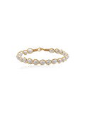 Gold bracelet with pearls on a white background