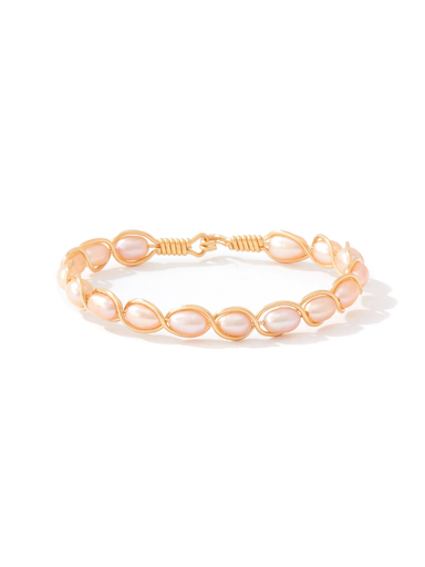 A delicate gold wire bracelet featuring a series of small, teardrop-shaped pale pink pearls, displayed on a clean white background.