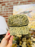 Dark olive camo with script southern marsh on front