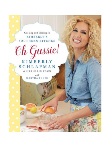 Book cover of 'Oh Gussie!' with a woman in a kitchen