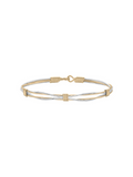 Two-tone gold and silver bracelet on a white background