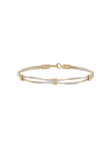 Two-tone gold and silver bracelet on a white background
