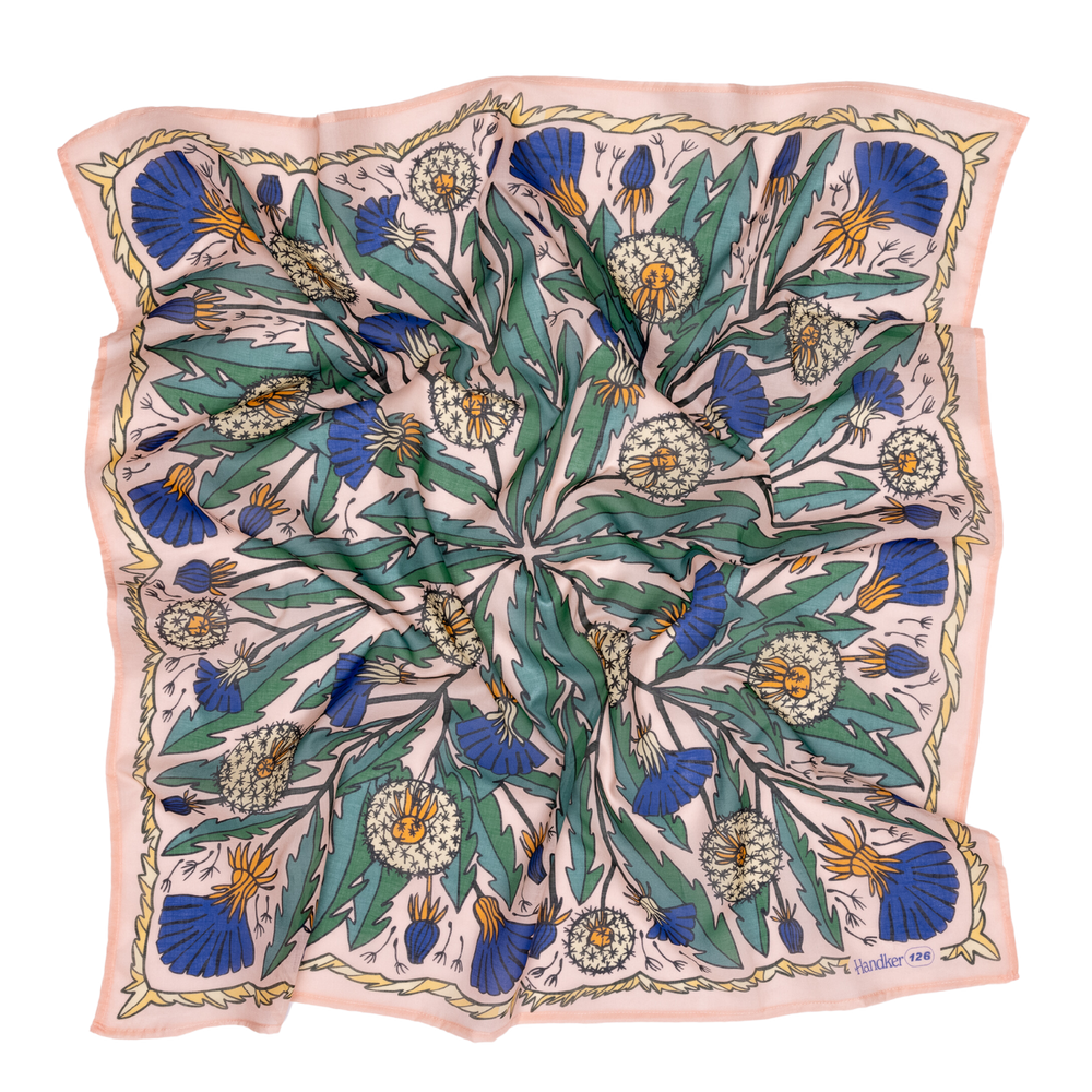 Floral patterned scarf with blue and green design on a beige background