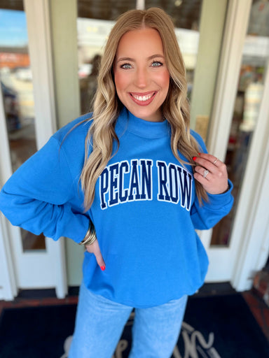 Mock neck sweatshirt with "Pecan Row" embroidered across the front 