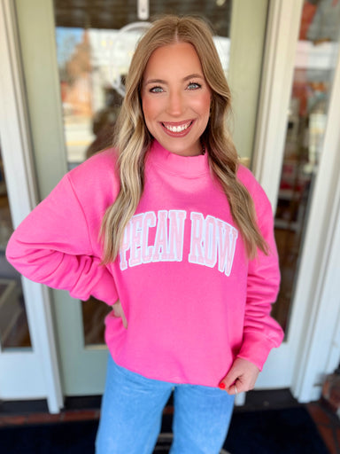 Mock neck sweatshirt with "Pecan Row" embroidered across the front 