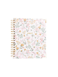 A 2027 spiral-bound planner with a delicate pink, orange, and green floral pattern on a white cover, featuring gold-toned metal spiral binding.
