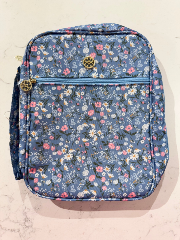 blue bible cover and pink flowers 
