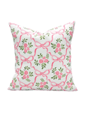 Decorative pillow with pink bows and flowers