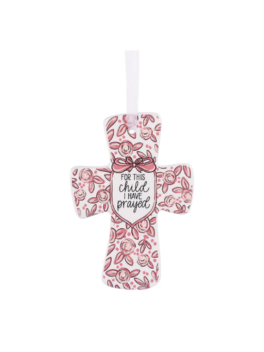 Decorative cross with pink floral pattern and text on a white background