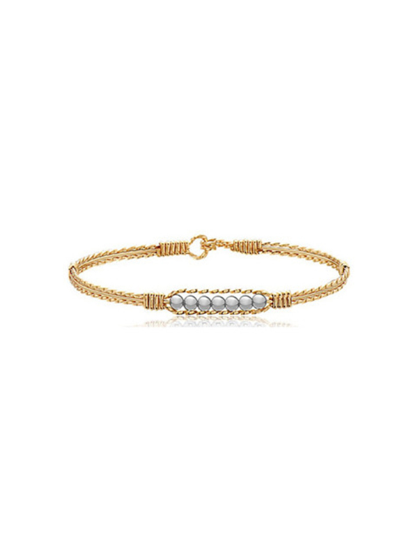 Gold bracelet with pearl beads on a white background
