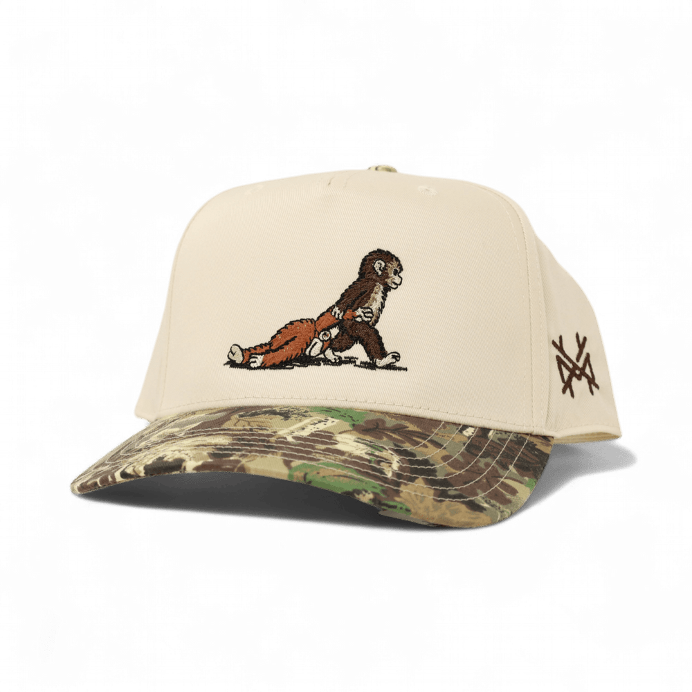 monkey dragging a monkey toy in camo