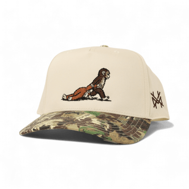 monkey dragging a monkey toy in camo