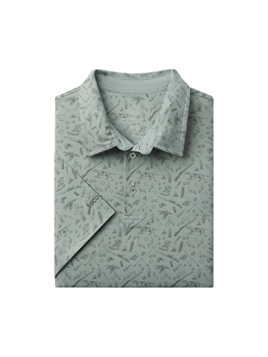 Sage green polo with guns, ducks antlers and dogs printed on it 
