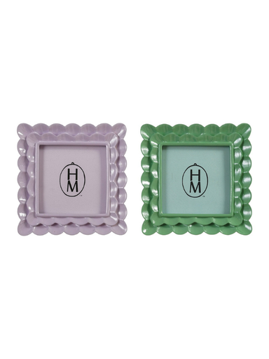 Two decorative square picture frames with scalloped edges, one in light purple and one in green