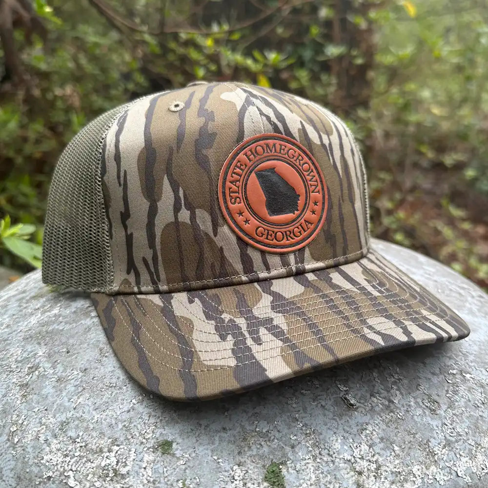 Georgia Pride Leather Patch Trucker Hat in Bottomland Camo by State Homegrown