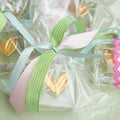 Gold heart-shaped painted on a sitter in clear wrappers 