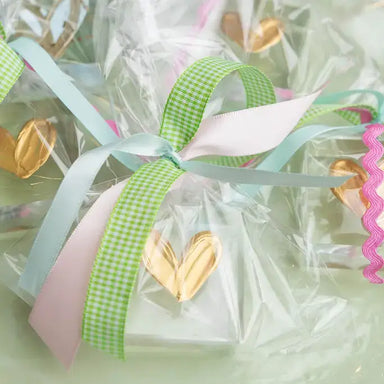 Gold heart-shaped painted on a sitter in clear wrappers 